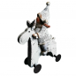 Preview: Winterkind auf rollendem Rentier charmante Weihnachtsfigur im Strickdesign